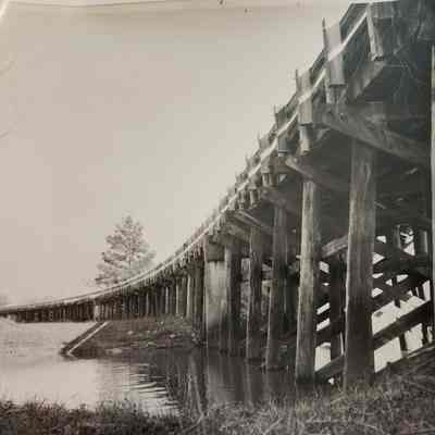 Photo of Wooden Railroad Bridge over water