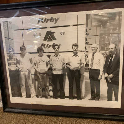 Framed Photo of Men in Front of a Stack of Kirby Lumber