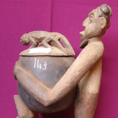 Male figure holding a pot