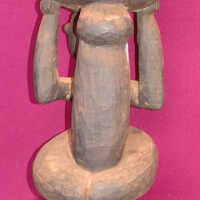 Female figure holding a container - Image 2