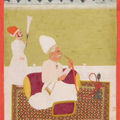 Seated official smoking a huqqa