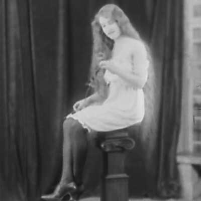 Young Woman on Pedestal