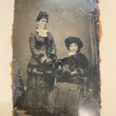 Handcolored portrait of standing and seated ladies