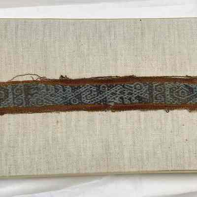 Textile fragment with stylized animal and serpent motif