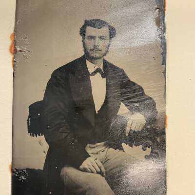 Handcolored 3/4 view portrait of seated gentleman