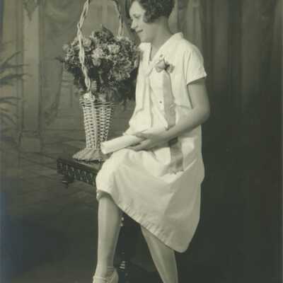 Young Lady Holding Rolled Paper (Diploma?)