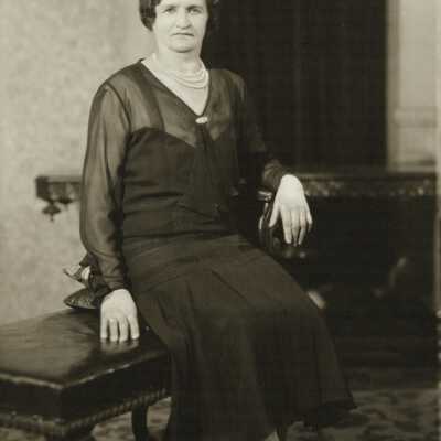 Older Woman Sitting on Bench