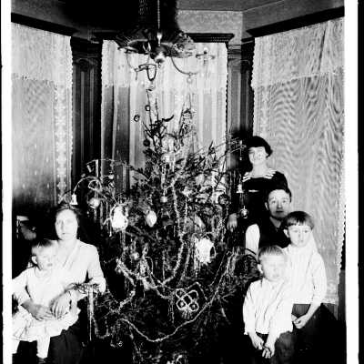Family Gathered Around the Christmas Tree