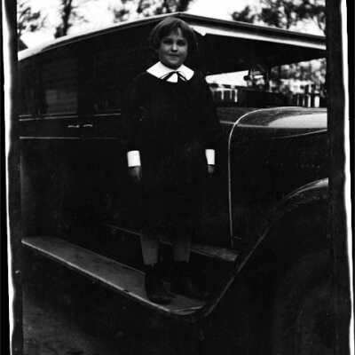 Child Standing with Automobile