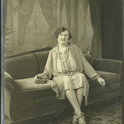 Woman Sitting on Sofa