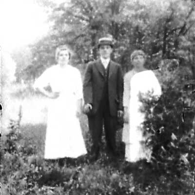 Man in a Hat and Two Women