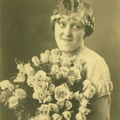 Woman Holding Bouquet of Flowers