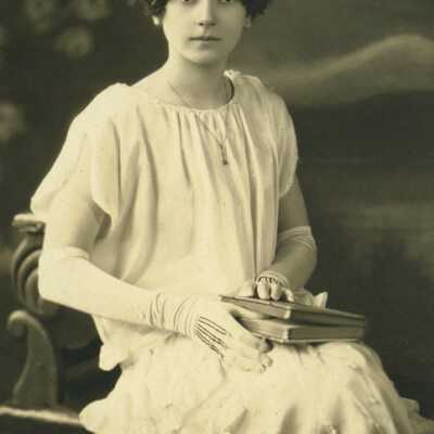 Girl Wearing Headpiece and Holding a Book