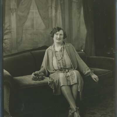 Woman Sitting on Sofa