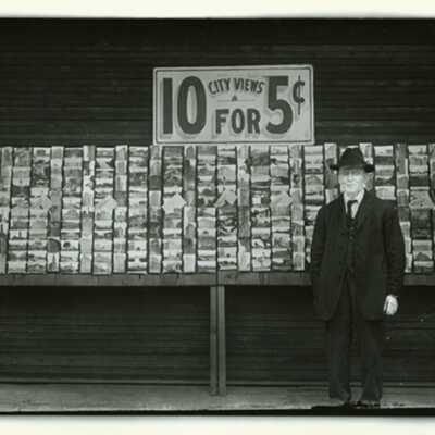 Man in Front of Newspaper Stand