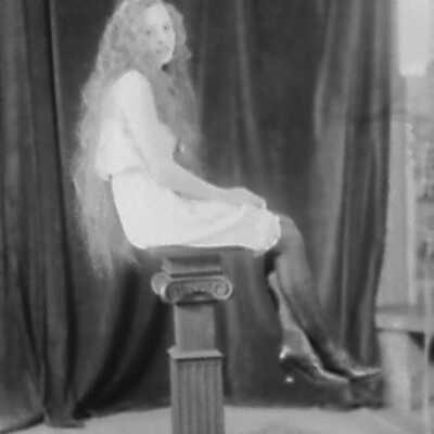Young Woman on Pedestal