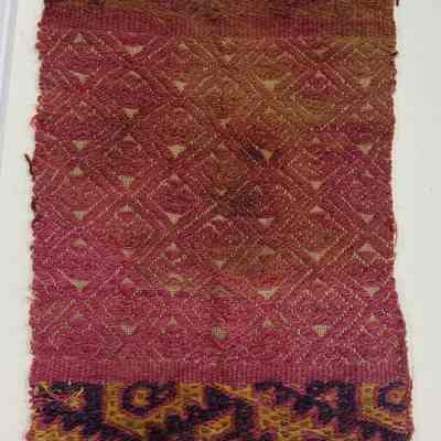 Textile fragment with bird and cat motif