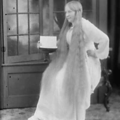 Woman with Long Hair Holding a Book