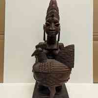 Kneeling female figure with bowl (olumeye)