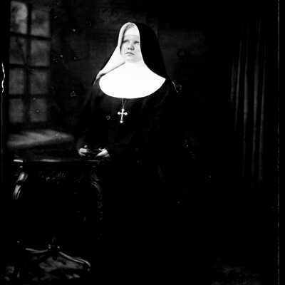 Nun Holding Book