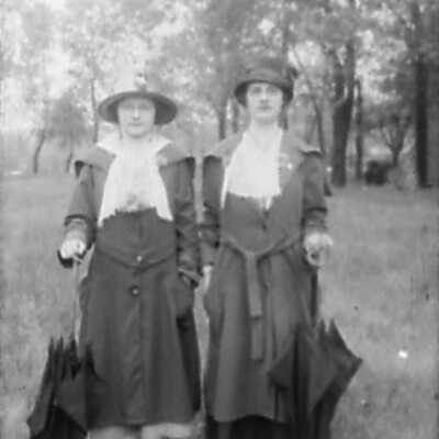 Two Women with Umbrellas