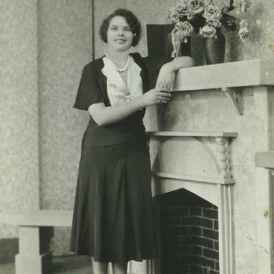 Woman Standing at Mantle