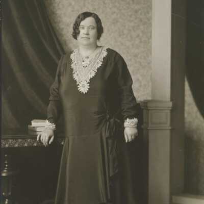 Woman Leaning on Table
