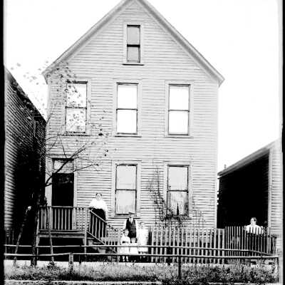 Family in Front of Home