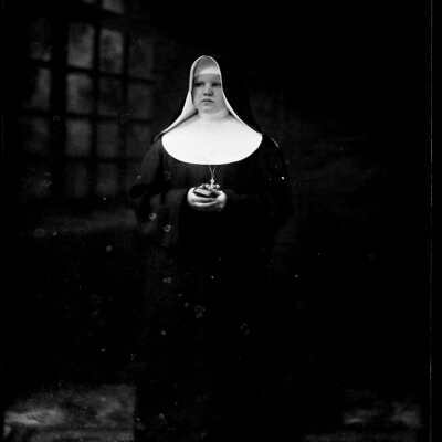 Nun Holding Book