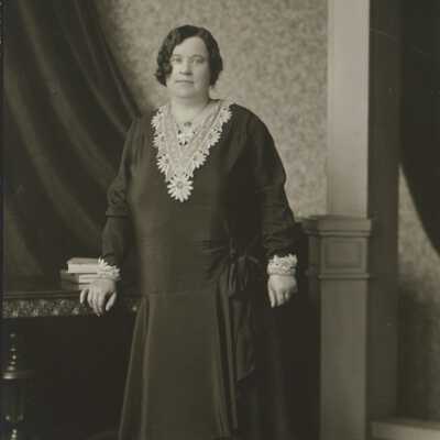 Woman Leaning on Table
