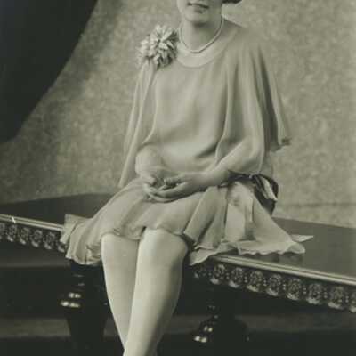 Young Woman Sitting on Table