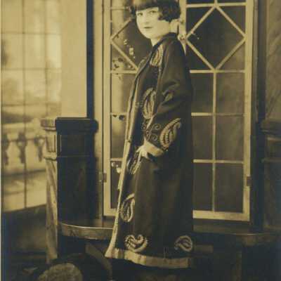 Young Woman Standing at Window
