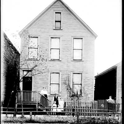 Family in Front of Home