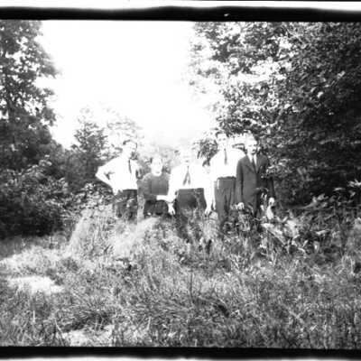 Family Standing Among Trees