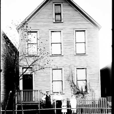 Family in Front of Home