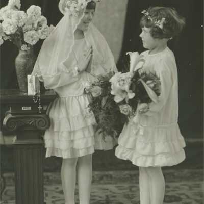 Two Girls Wearing Headpieces