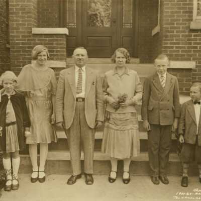 Family Outside of Their Home