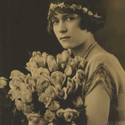 Young Woman Holding Bouquet of Roses