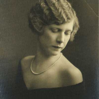 Young Woman Wearing Shoulderless Dress
