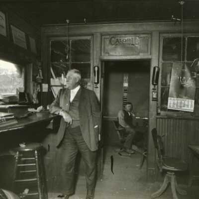 George M. and George A. Bryant in grain elevator office