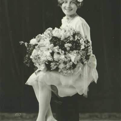 Young Lady Holding Bouquet of Flowers