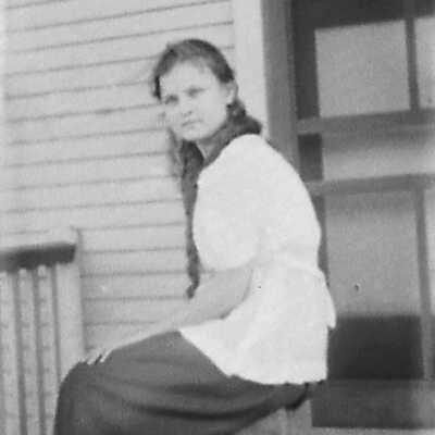 Young Woman Sitting on Porch