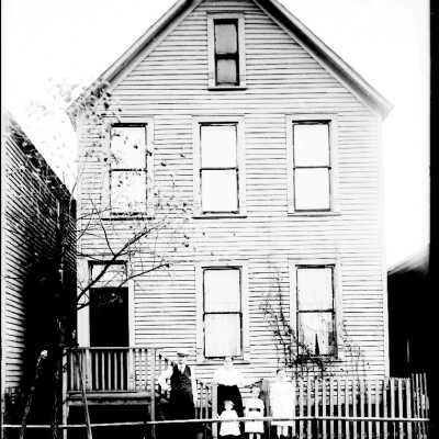Family in Front of Home