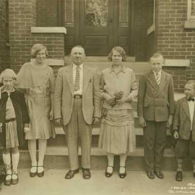 Family Outside of Their Home
