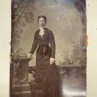Handcolored portrait of standing woman