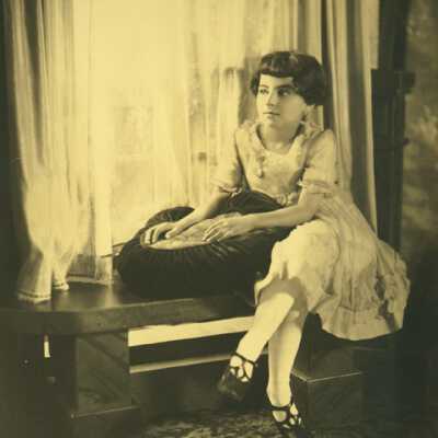 Girl Sitting at Window