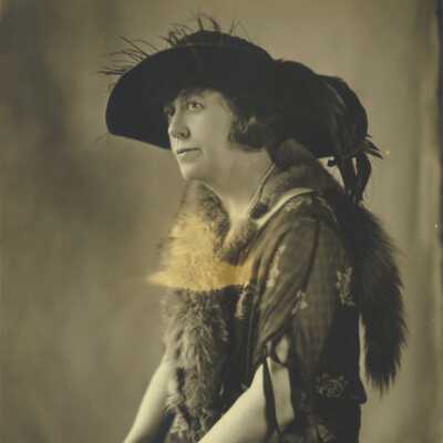 Woman Wearing Large-brimmed Hat and Fur Stole