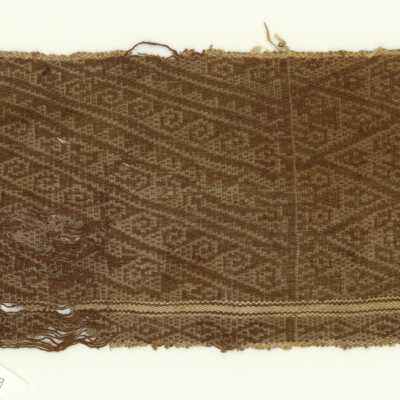 Textile fragment with stylized bird motif