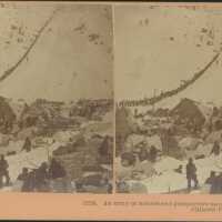 An army of miners and prospectors ascending the heights of the Chilcoot Pass.