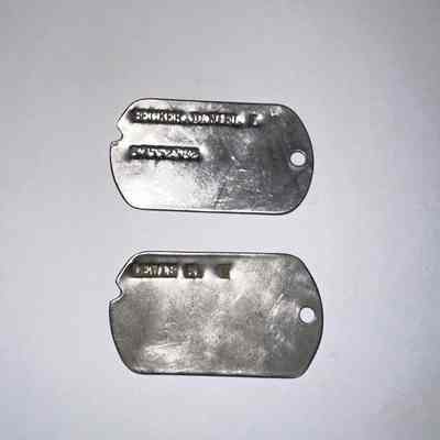 Two Error Dog Tags made at Camp Claiborne, LA